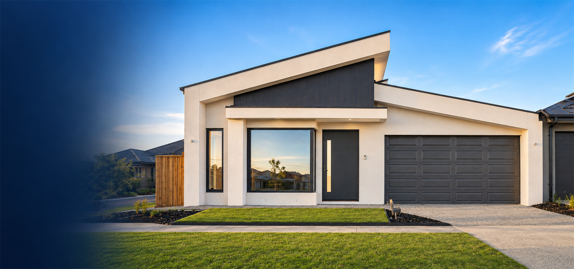 Contemporary Melbourne home with a clean facade, garage and driveway under a blue sky
